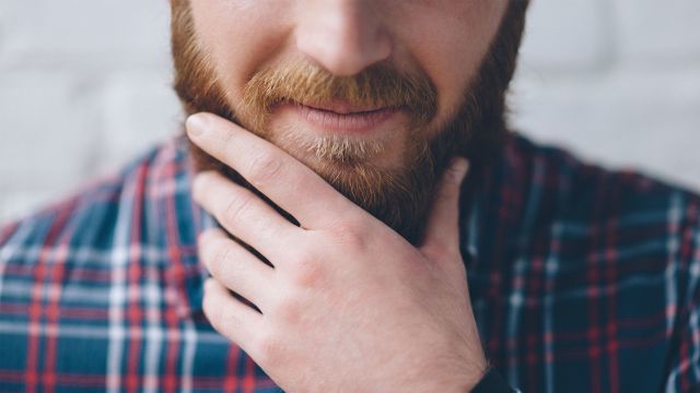 Man stroking his beard