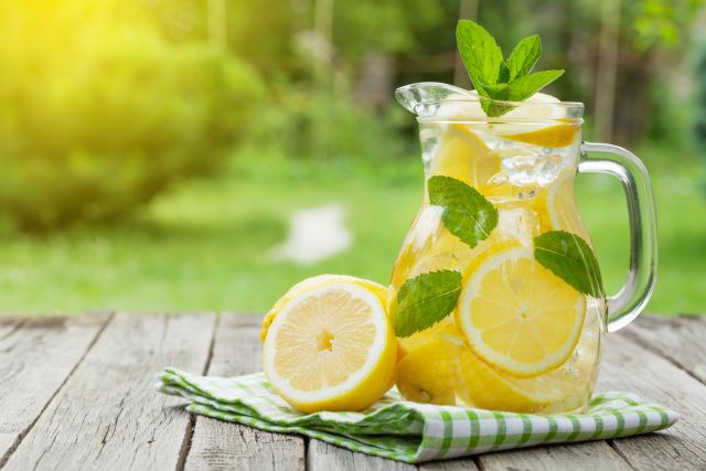 Pitcher of lemonade outside on table