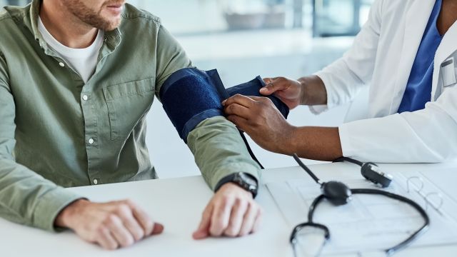 doctor checking blood pressure