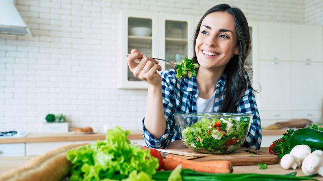 woman eating salad