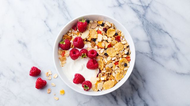A bowl of granola with raspberries is just one idea when it comes to heart-healthy breakfast foods to keep you fit.