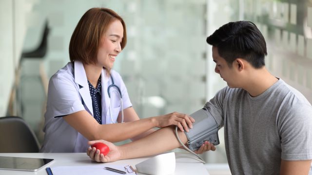 doctor measuring blood pressure