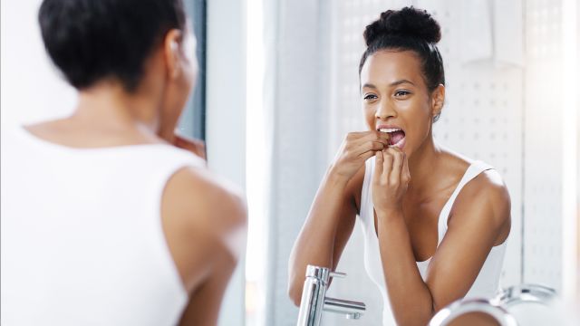 woman flossing