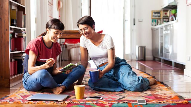 Two women journaling and having a discussion