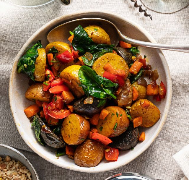 Roasted potatoes with veggies in a bowl