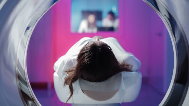 A young girl begins a CT scan. CT scans may be used to diagnose meningitis B.