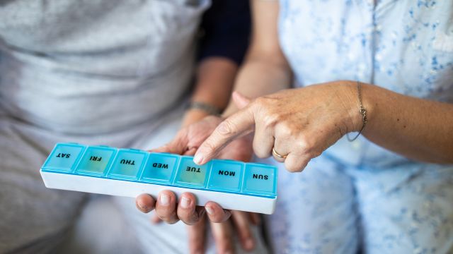 Older couple with pill box.