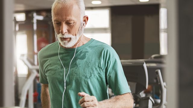 A male patient exercises on a treadmill. Exercise is a cornerstone of health and important to maintain when treating cancer.