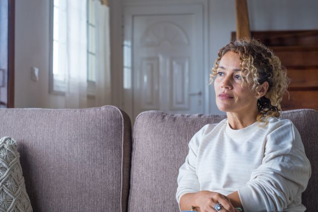 woman sitting on couch