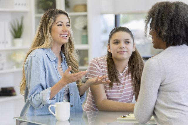 Mom and pre-teen daughter attend a counseling session to discuss adhd treatment.