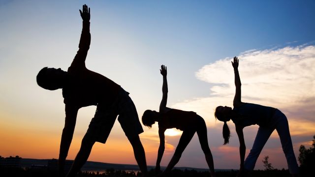 yoga pose against sunset