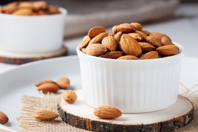 a picture of a small bowl full of almonds