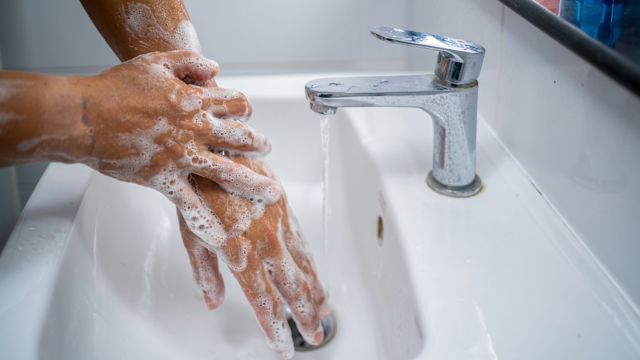 A man washes his hands with soap and hot water. Hygiene and other basic precautions are an important part of preventing infections for people living with primary immunodeficiency.