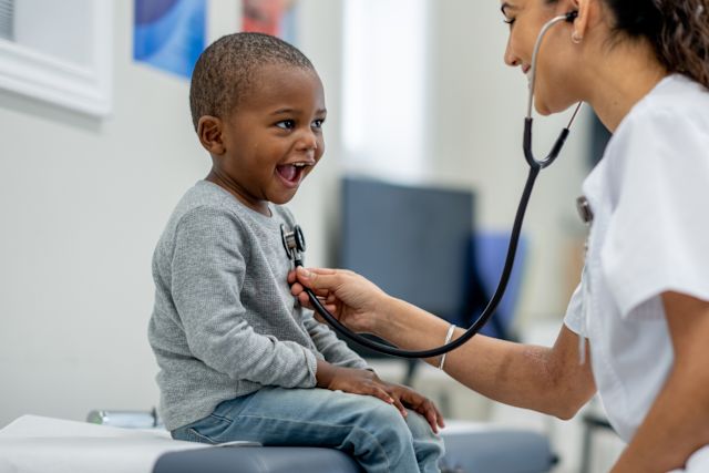 young boy receiving checkup at healthcare provider's office