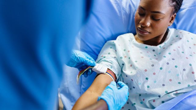 A woman receives a blood transfusion as part of treatment for beta thalassemia major.