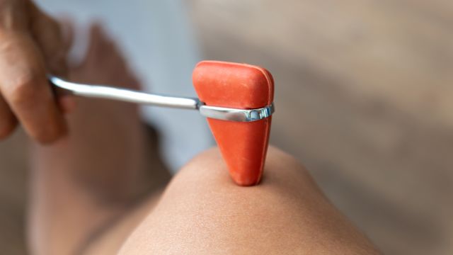A doctor performs a simple examination to check for nerve damage in a patient that has diabetes.