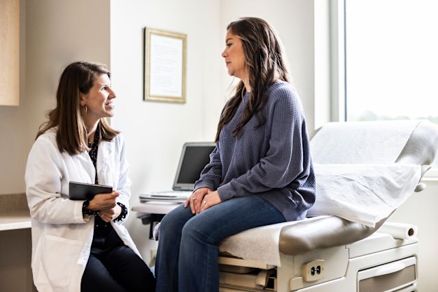 woman patient talking to woman healthcare provider