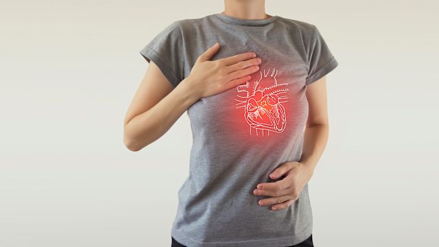 A young woman has a diagram of a heart superimposed over her chest.