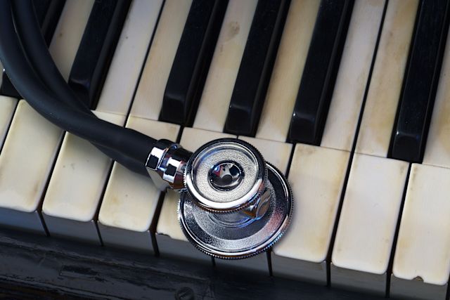 Stethoscope on a vintage piano keyboard