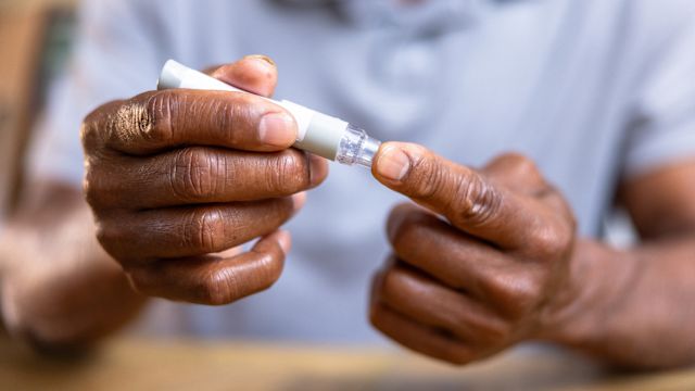 An older man tests his blood sugar. Diabetes control is an important element of a treatment plan for diabetic macular edema.