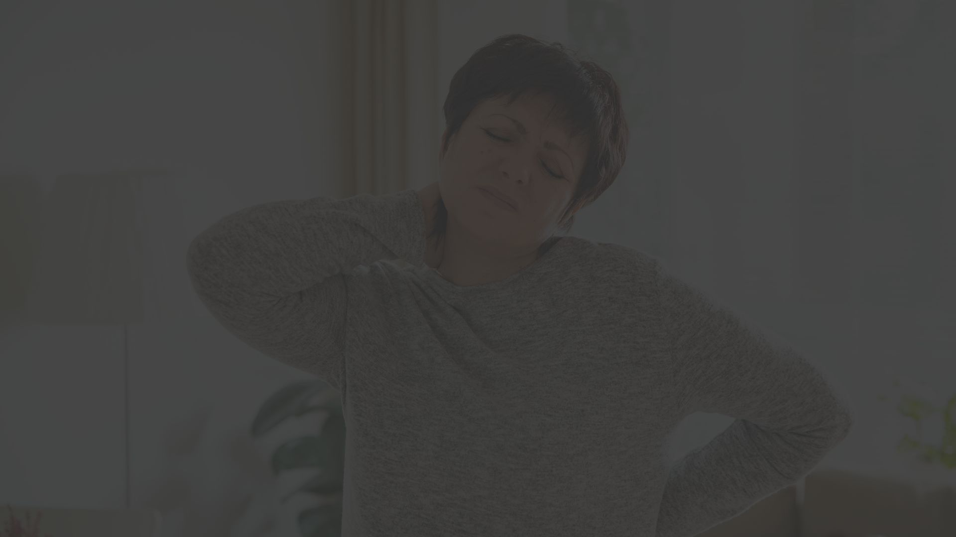 woman with neck and back pain