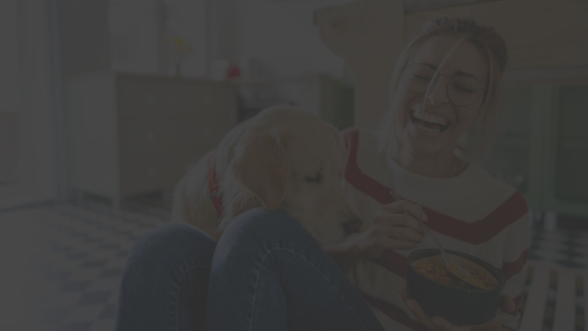 eating woman laughing with her dog