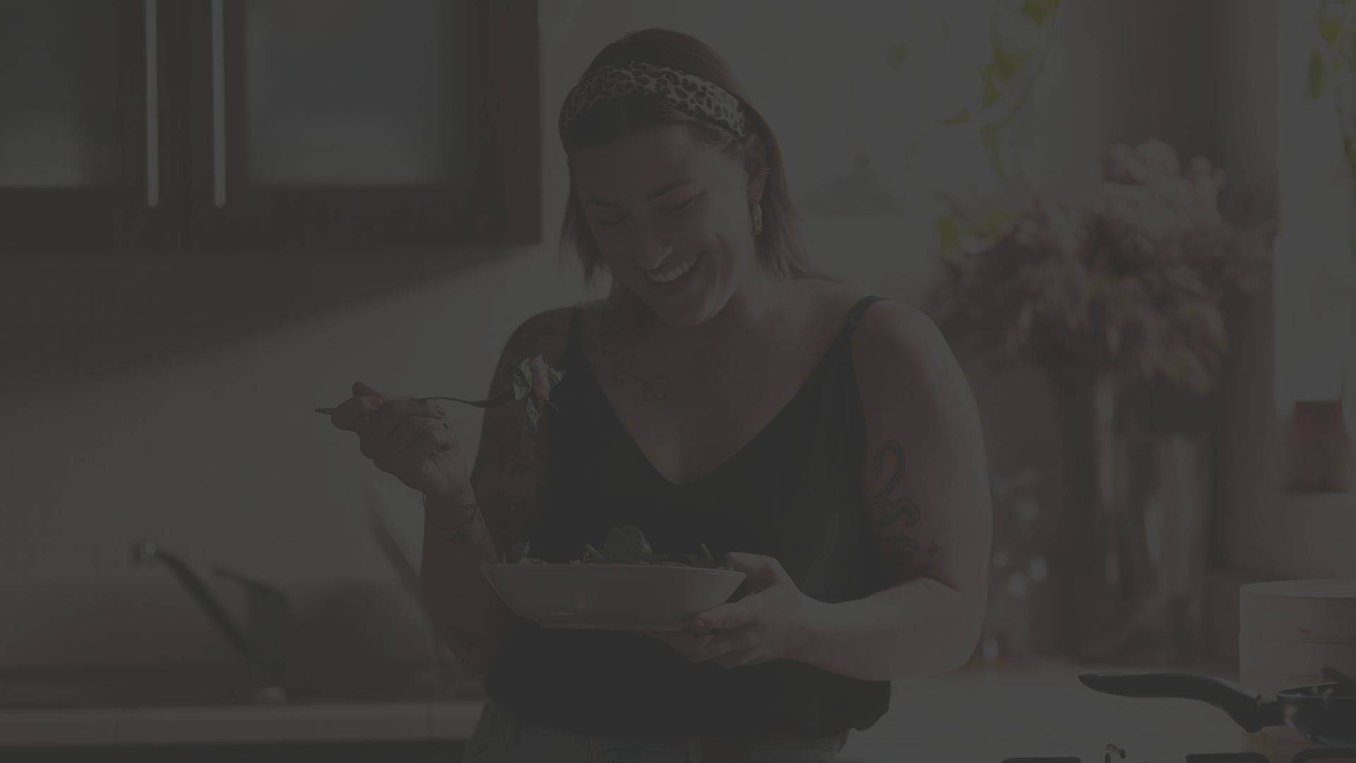 young person eating in the kitchen