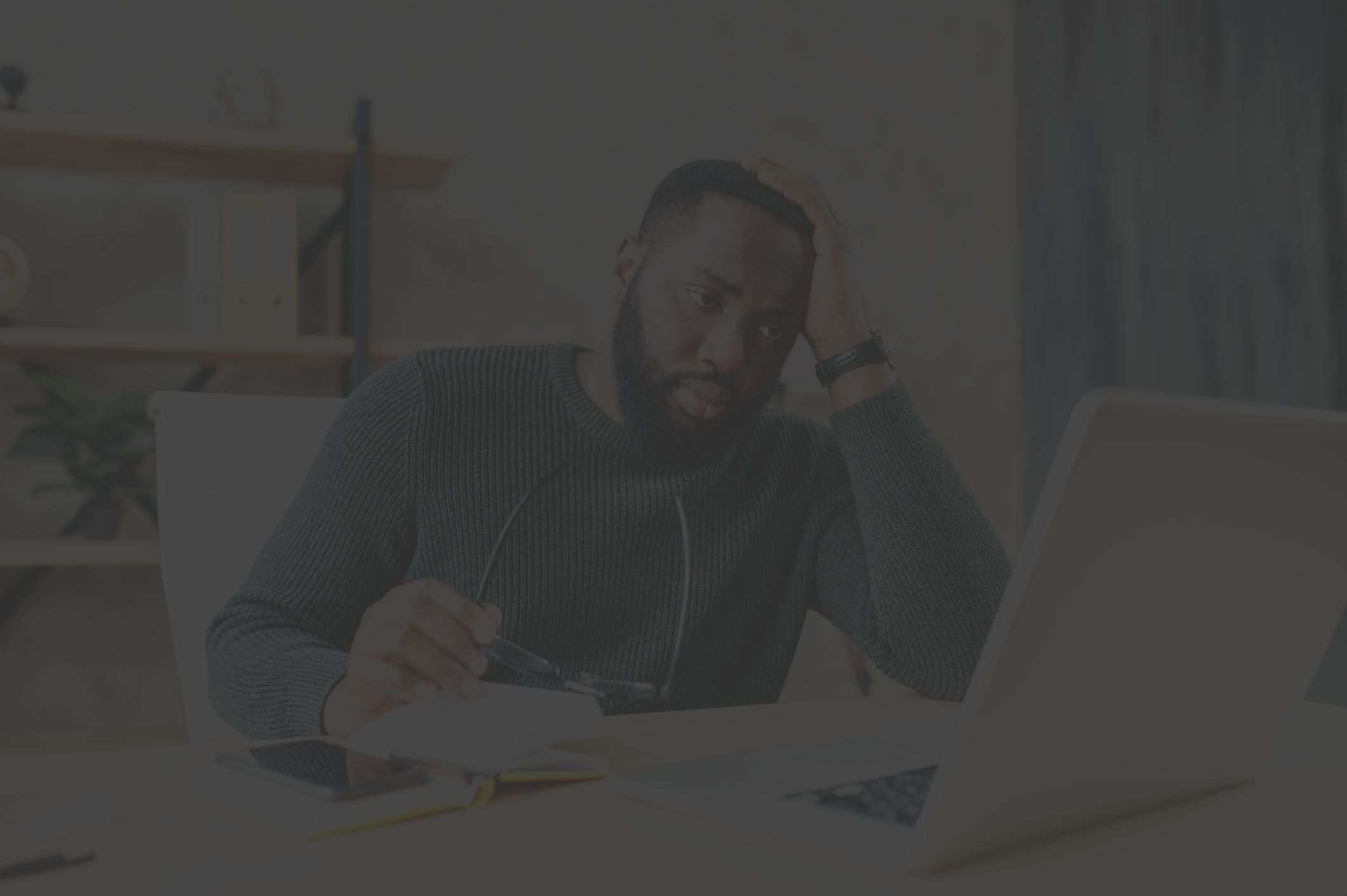 Man stressed at computer