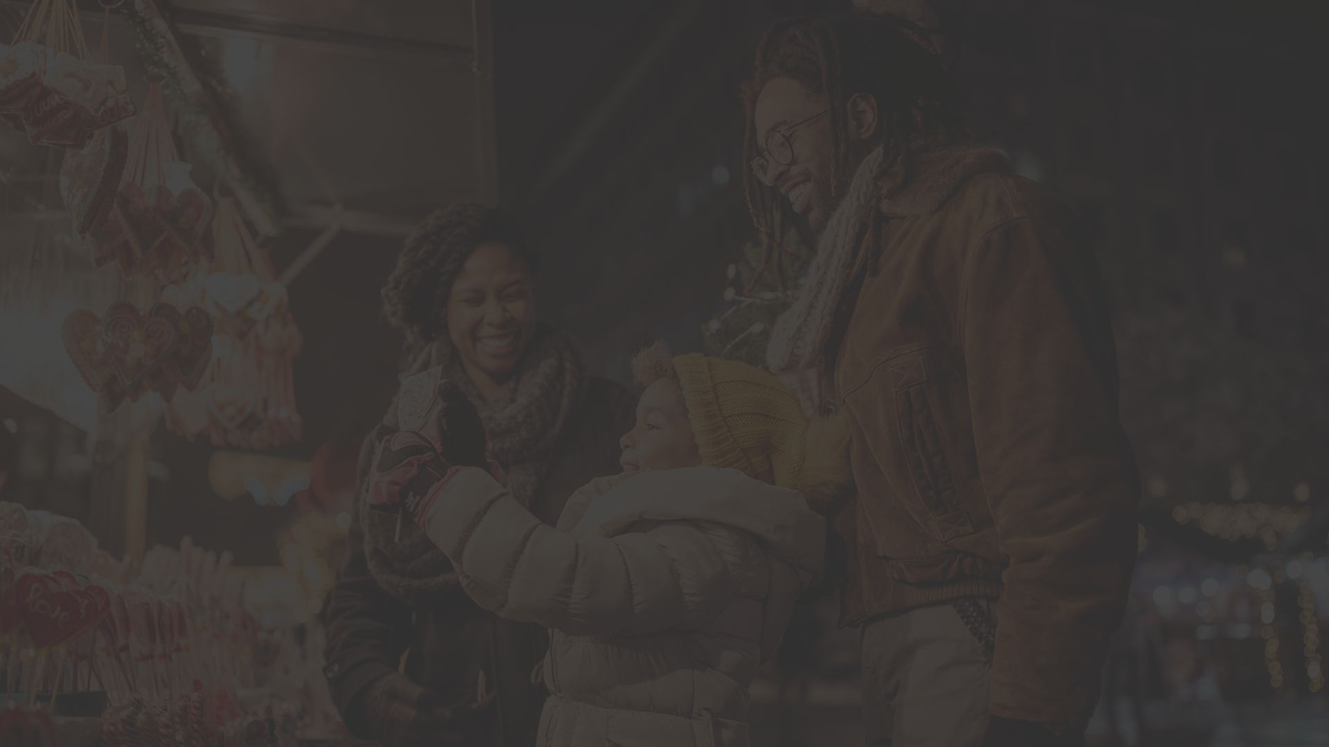 A happy family purchasing non-toxic gifts at a street vendor