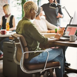 Woman with a laptop in a modern office